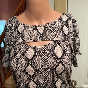 WILD LOVE. Snake print dress ruched on sides w/ties. Cut out just above …